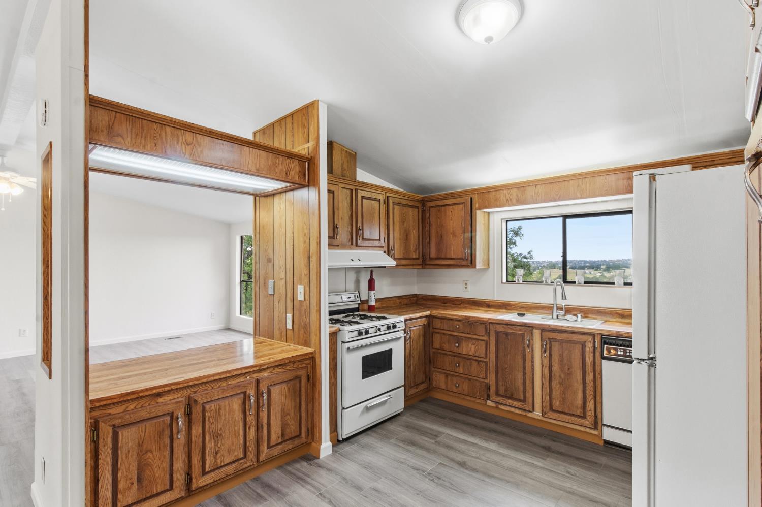 10580 Thompson Way Valley Springs, CA 95252 - Photo 17 of 64 a kitchen with stainless steel appliances granite countertop a stove and a sink