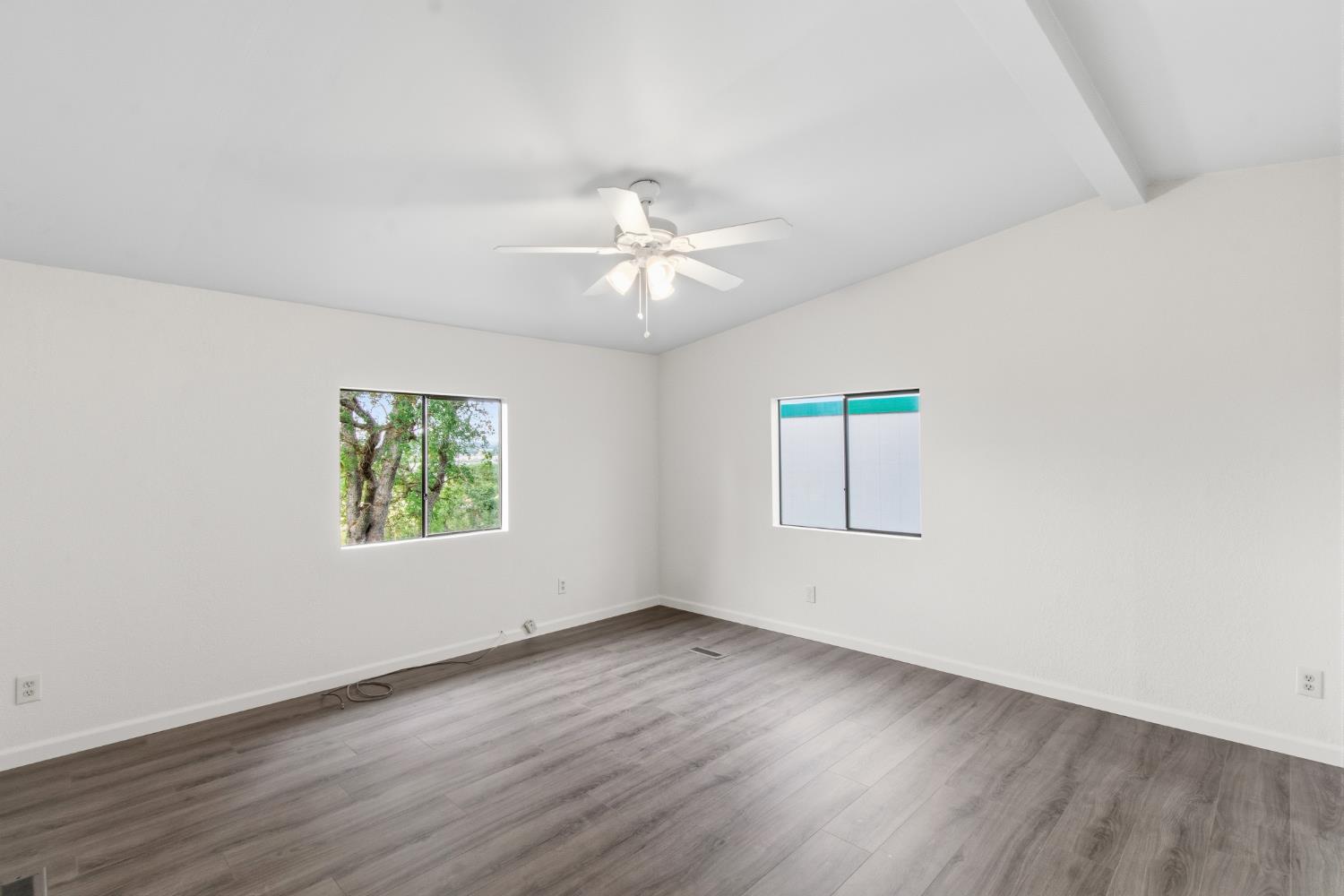 10580 Thompson Way Valley Springs, CA 95252 - Photo 20 of 64 an empty room with wooden floor and windows
