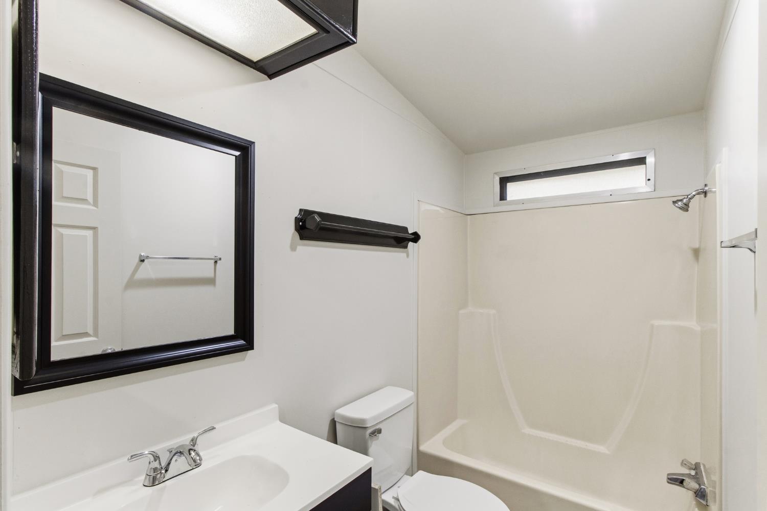 10580 Thompson Way Valley Springs, CA 95252 - Photo 26 of 64 a bathroom with a bathtub shower sink and mirror