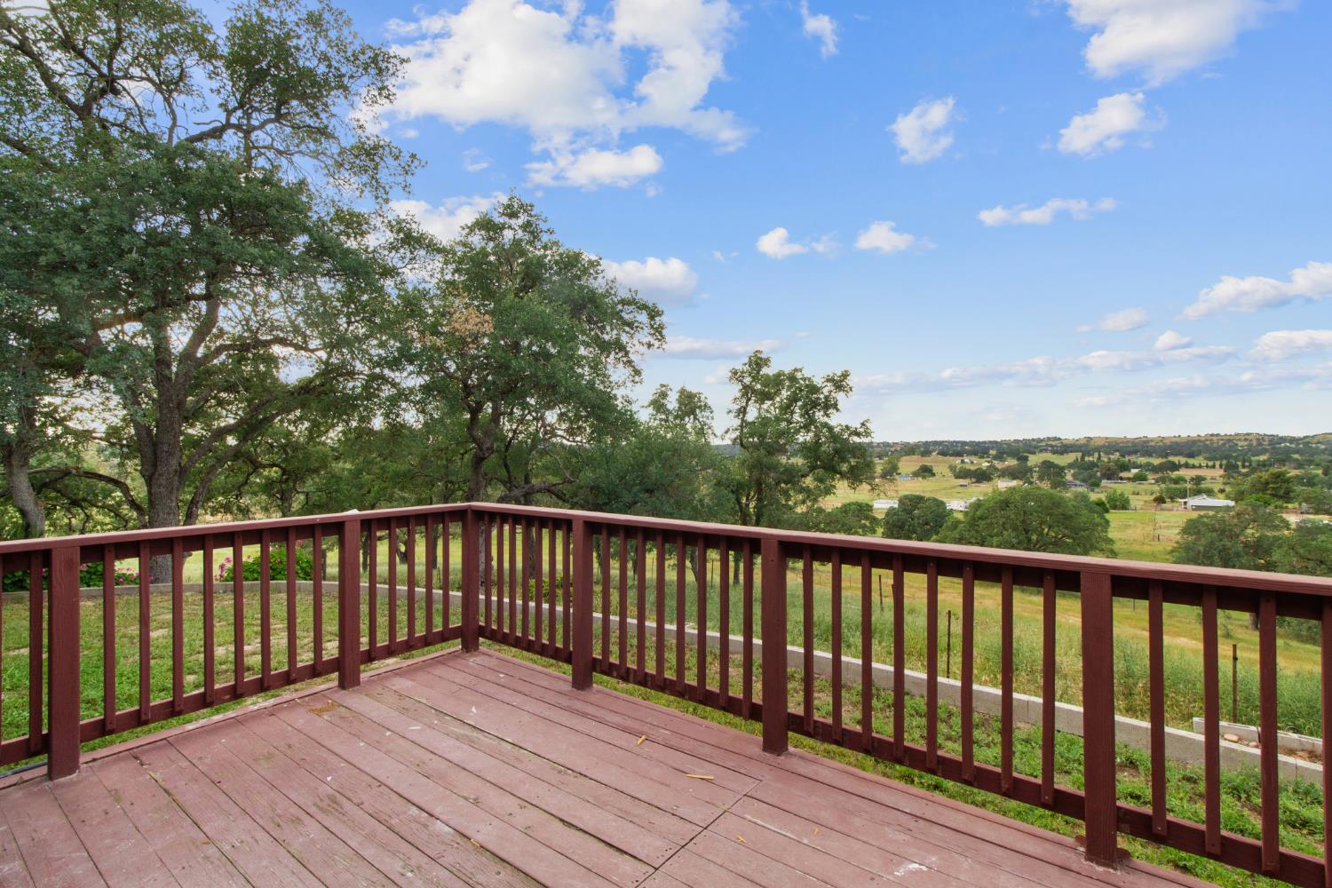 10580 Thompson Way Valley Springs, CA 95252 - Photo 6 of 64 a view of balcony with wooden floor and fence