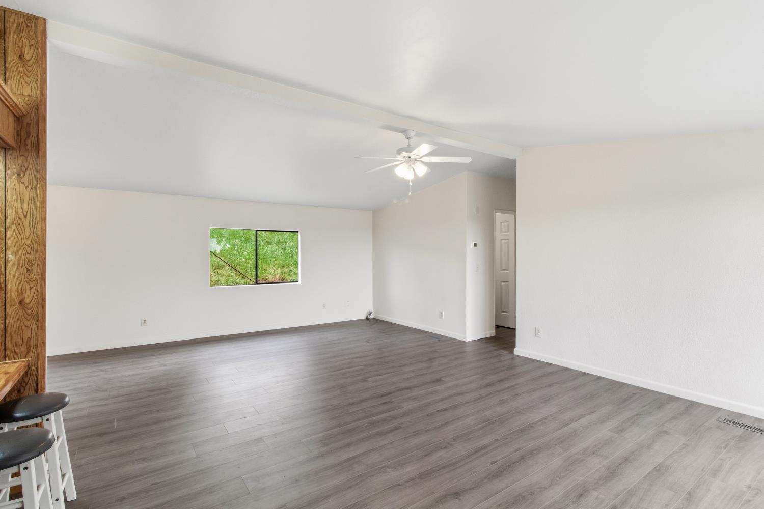 10580 Thompson Way Valley Springs, CA 95252 - Photo 10 of 64 an empty room with wooden floor and windows