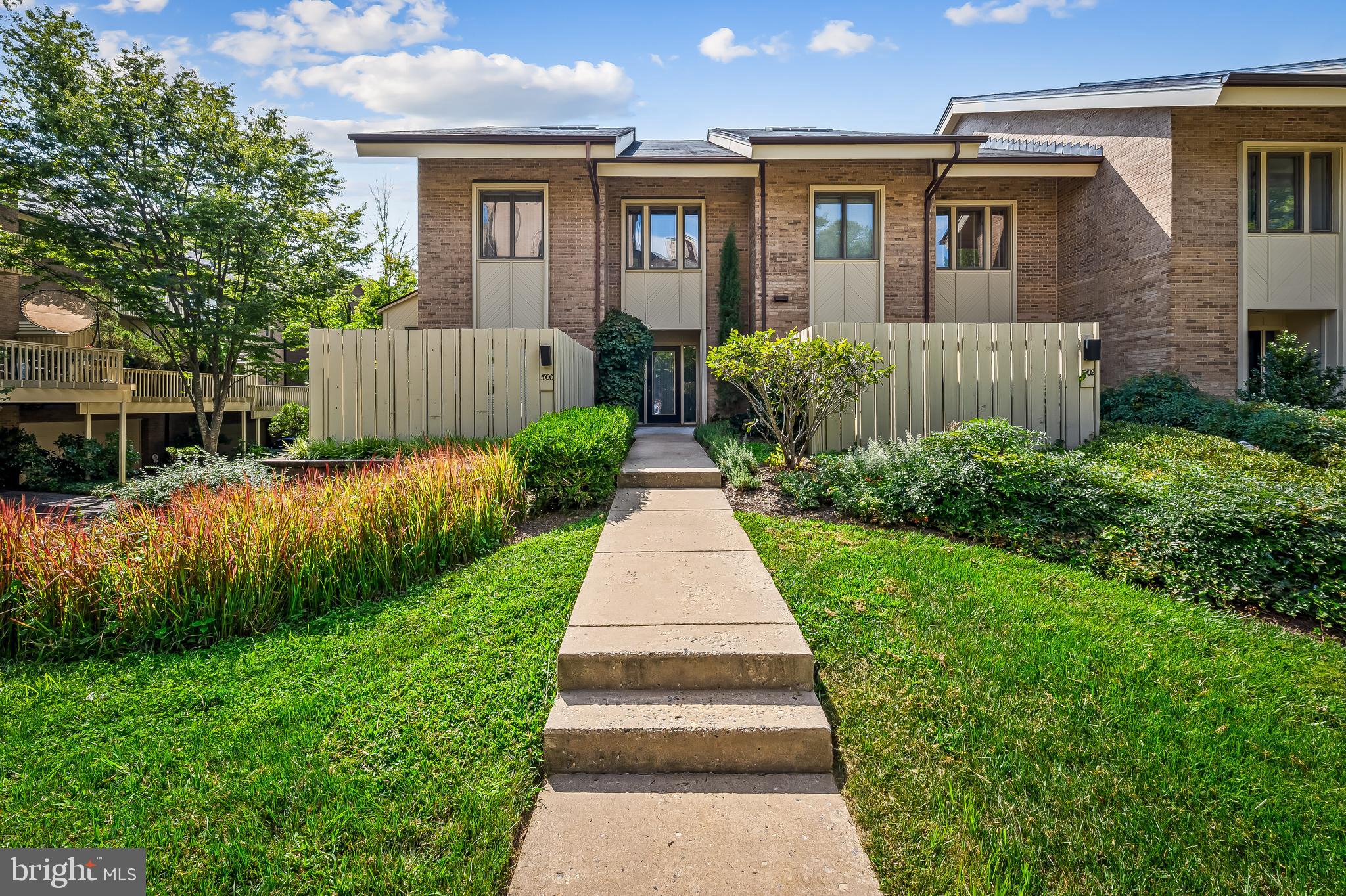 a front view of a house with yard