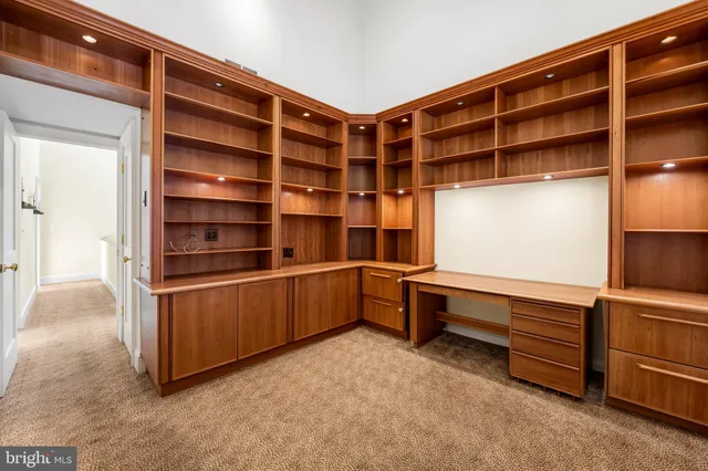 a view of an empty room with shelves