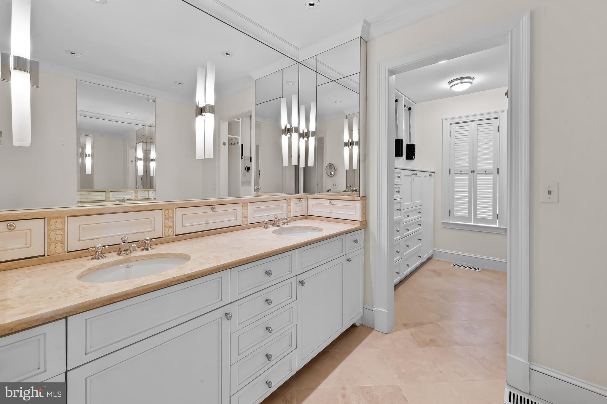 5700 Coley Court Baltimore, MD 21210 - Photo 27 of 53 a spacious bathroom with a shower sink double and mirror