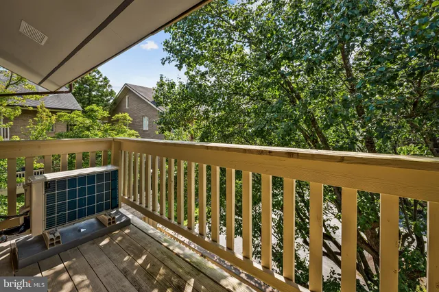 a view of an empty room with furniture and closet