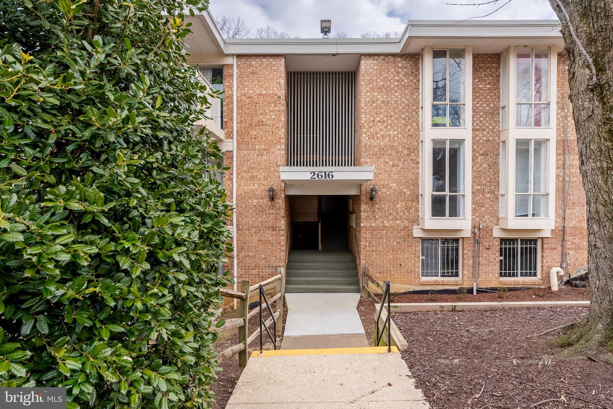 2616 Fort Farnsworth Road, Unit 242 Alexandria, VA 22303 - Photo 6 of 6 front view of a house with a yard
