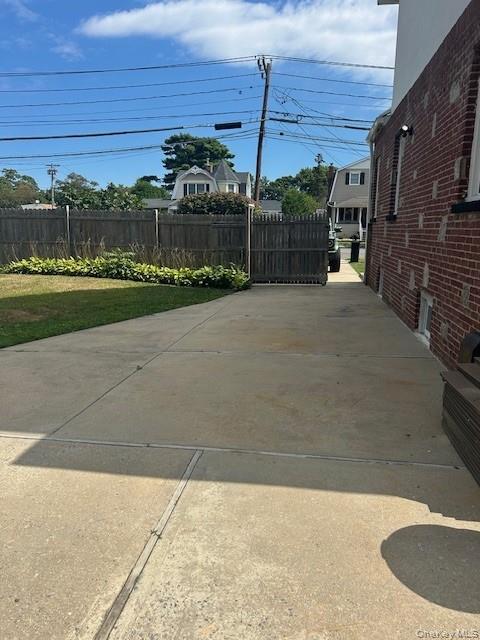 309 South Broadway, Unit 2 UPPER LEVEL Lindenhurst, NY 11757 - Photo 12 of 13 a view of a backyard