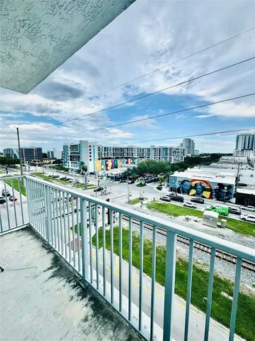 a city view from a balcony with city view