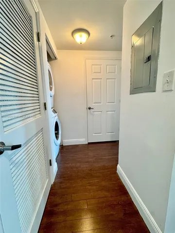 a view of a storage and utility room with washer and dryer