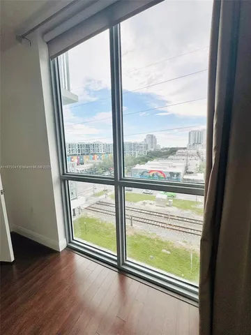 a bath tub sitting next to a white toilet and sink