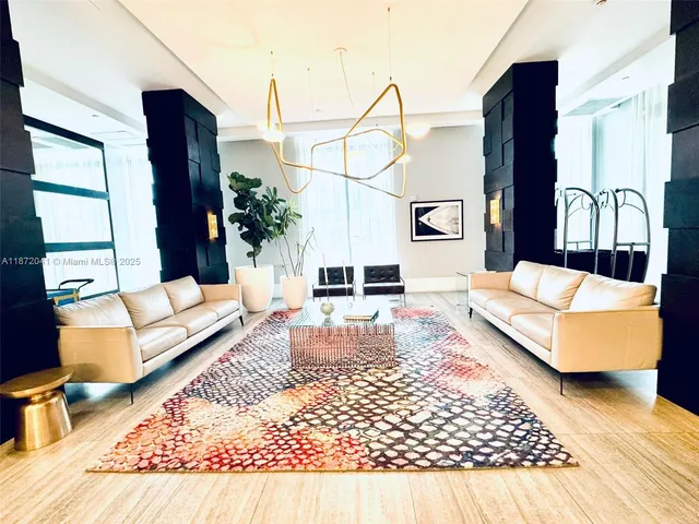 a view of a room with wooden floor and window