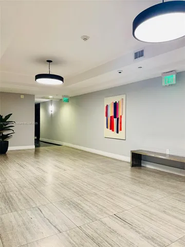a view of a hallway with a potted plant