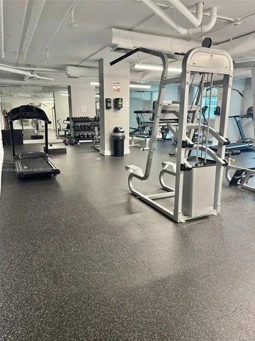 a view of a living room kitchen and a wooden floor