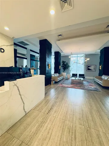 a bedroom with a bed and glass door