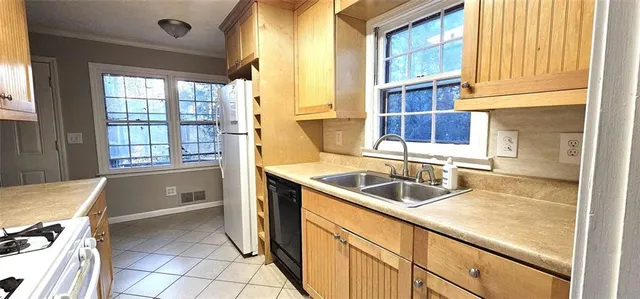 a kitchen with a sink and a window