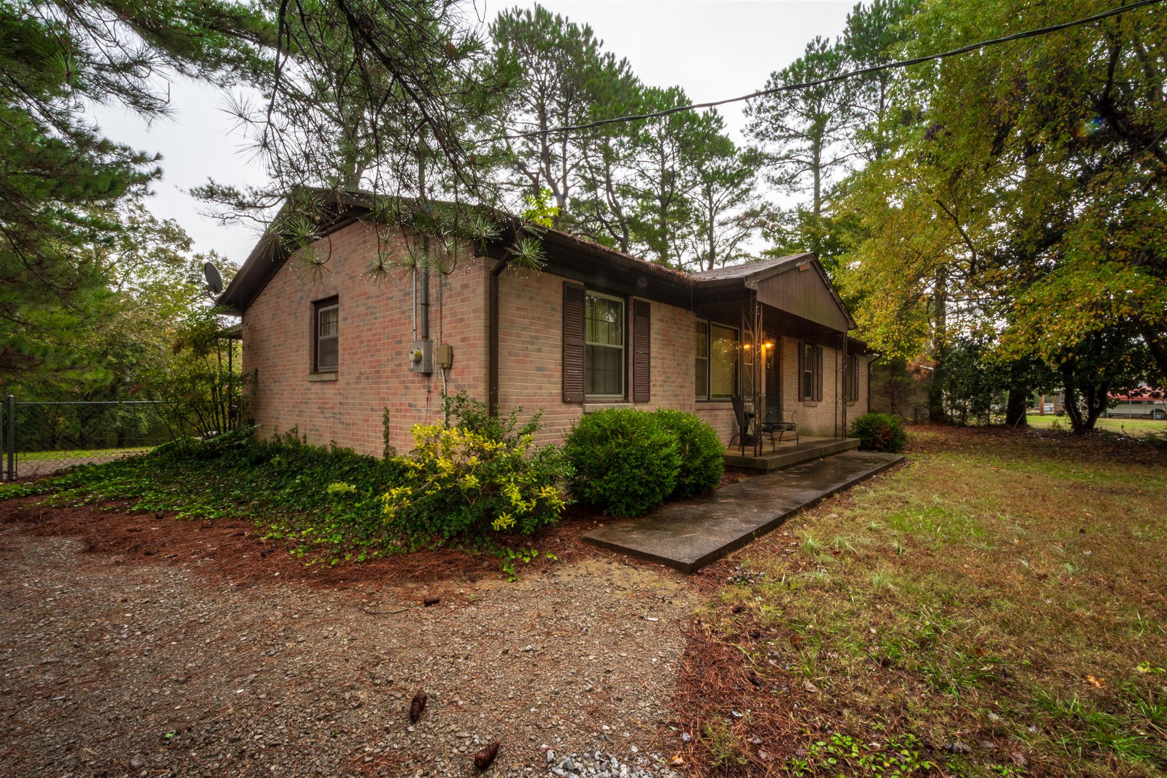1309 Oak Grove Road Goodspring, TN 38460 - Photo 1 of 29 a front view of house with yard and trees