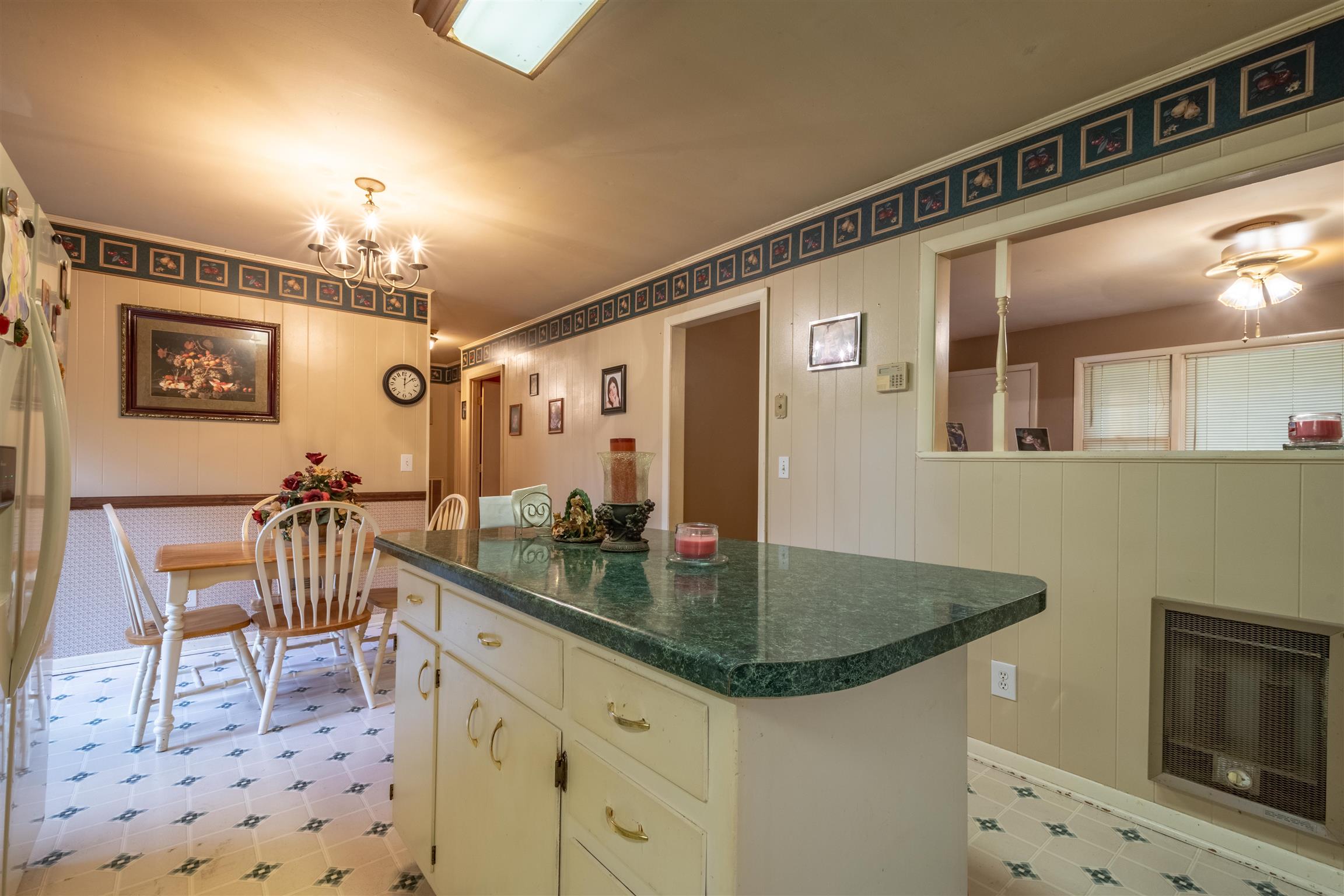 1309 Oak Grove Road Goodspring, TN 38460 - Photo 13 of 29 a kitchen with a table chairs sink and cabinets