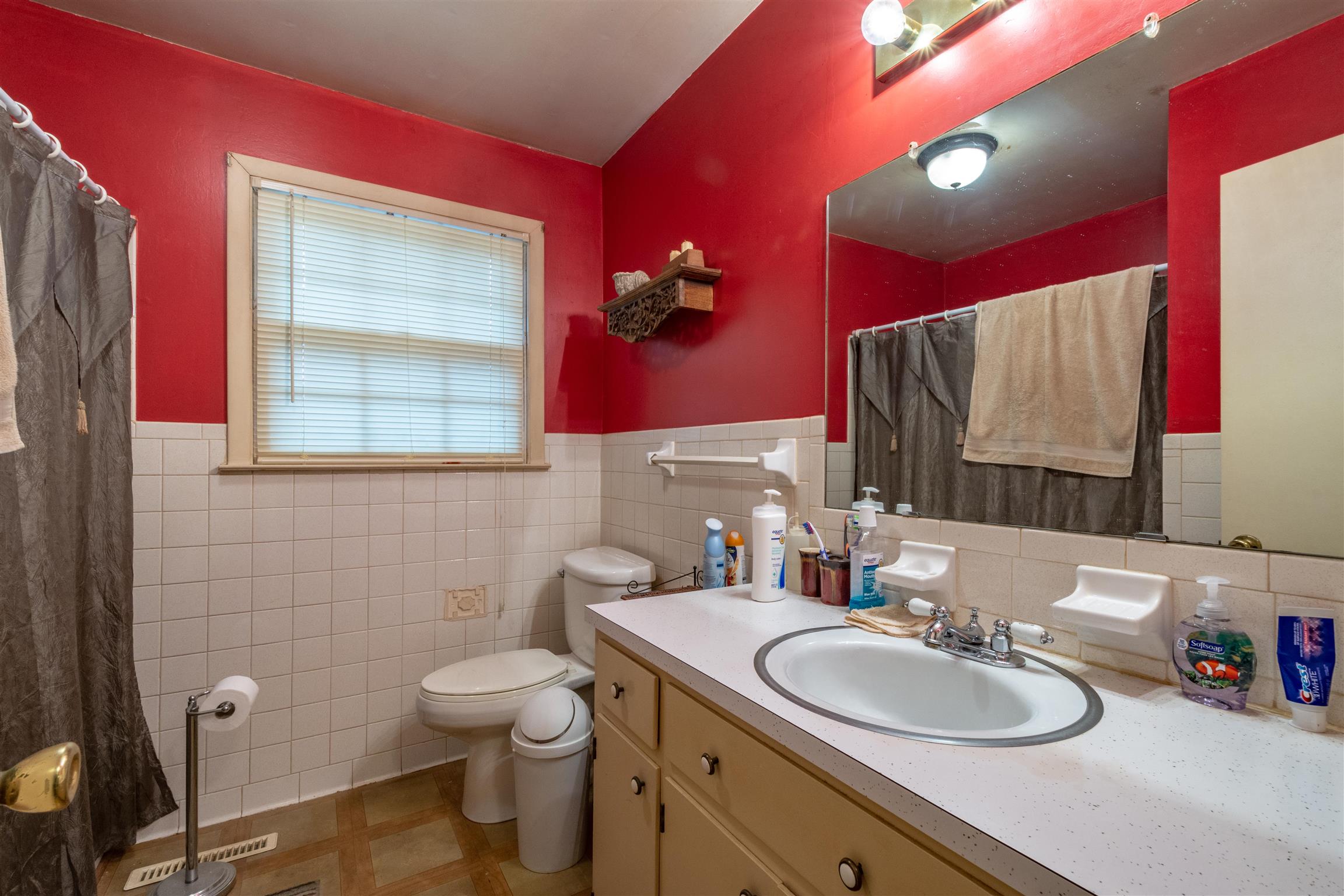 1309 Oak Grove Road Goodspring, TN 38460 - Photo 16 of 29 a bathroom with a toilet sink and mirror