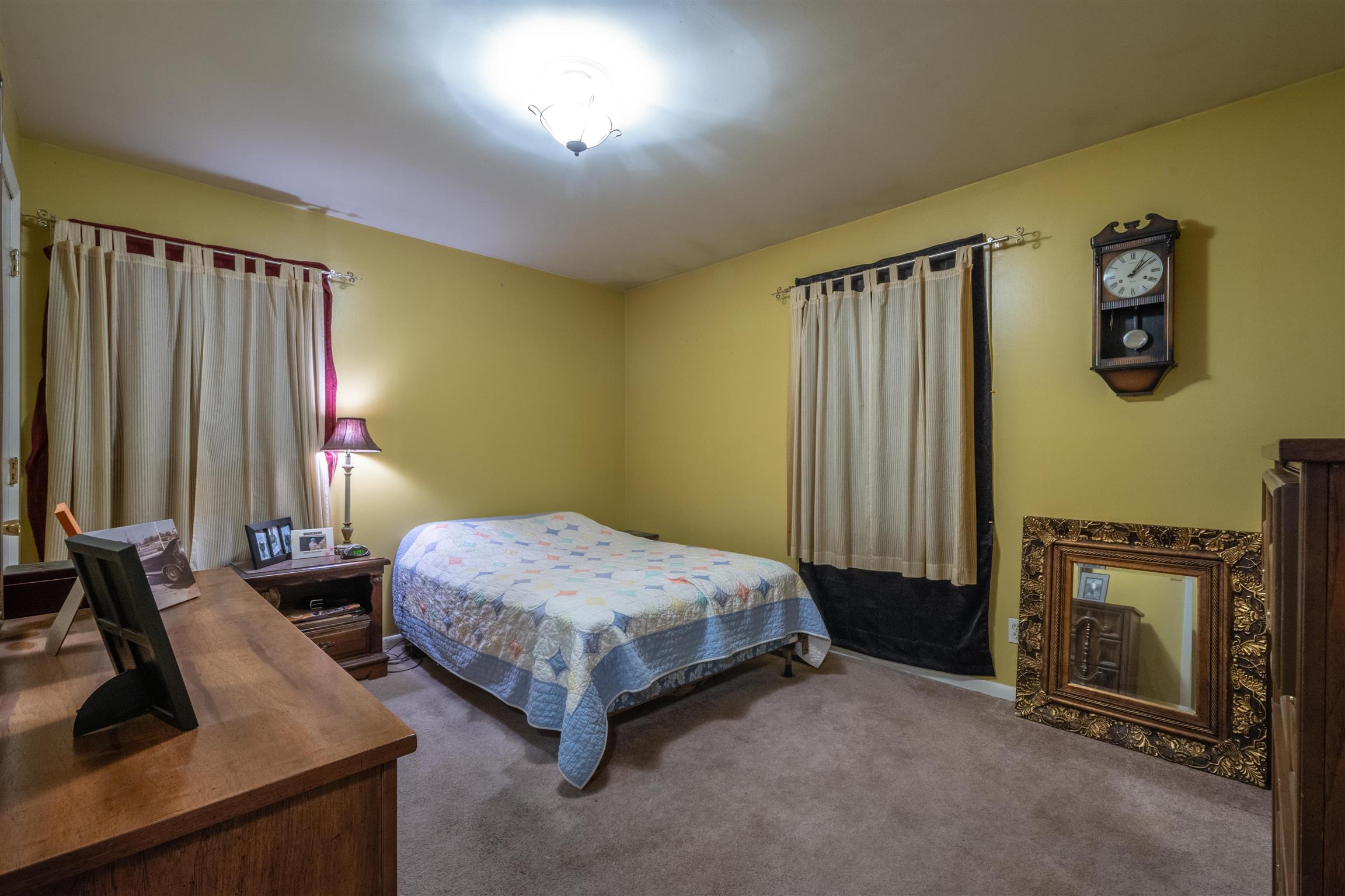 1309 Oak Grove Road Goodspring, TN 38460 - Photo 17 of 29 a bedroom with a bed and a dresser with mirror