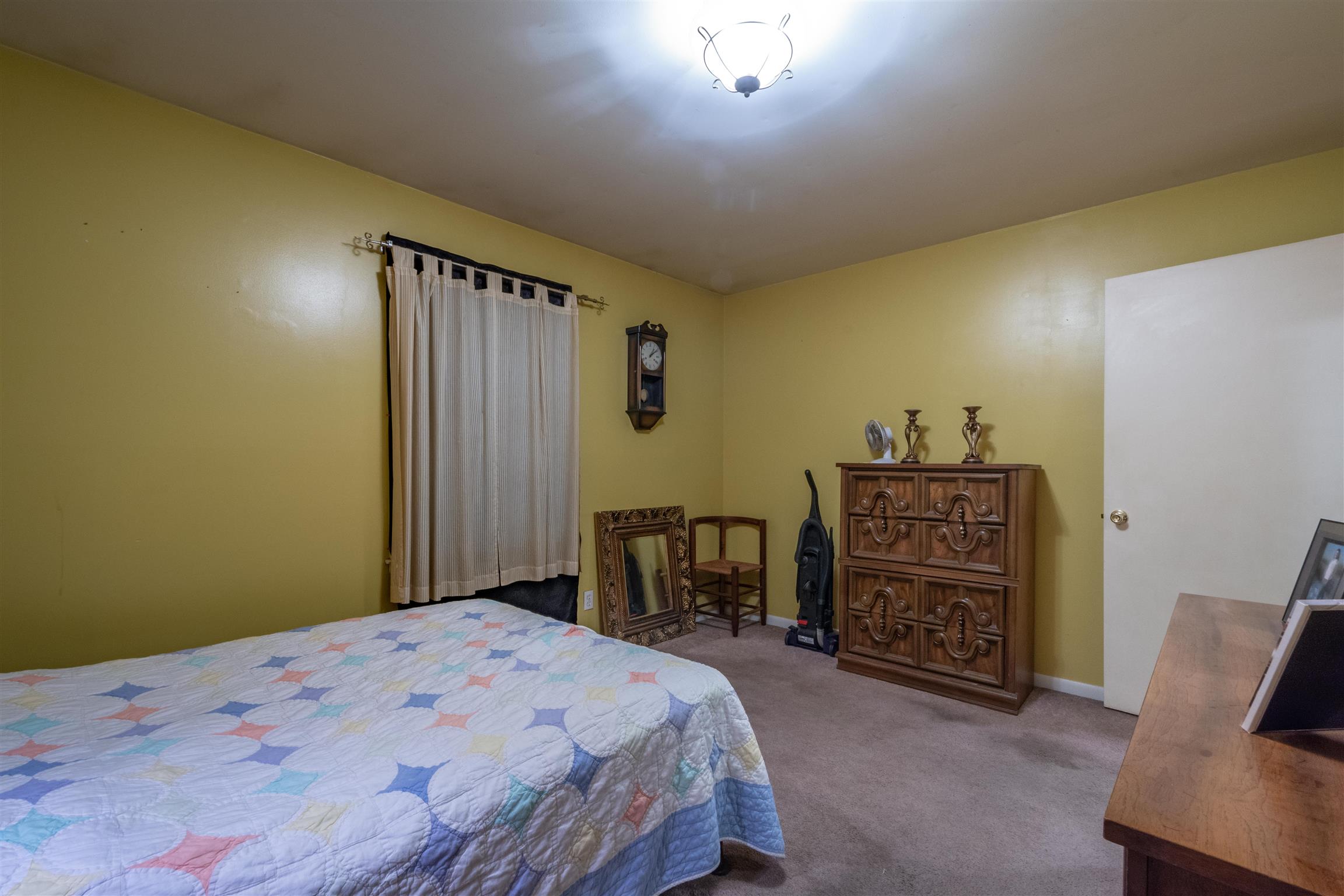 1309 Oak Grove Road Goodspring, TN 38460 - Photo 19 of 29 a bedroom with a bed dresser and a chair