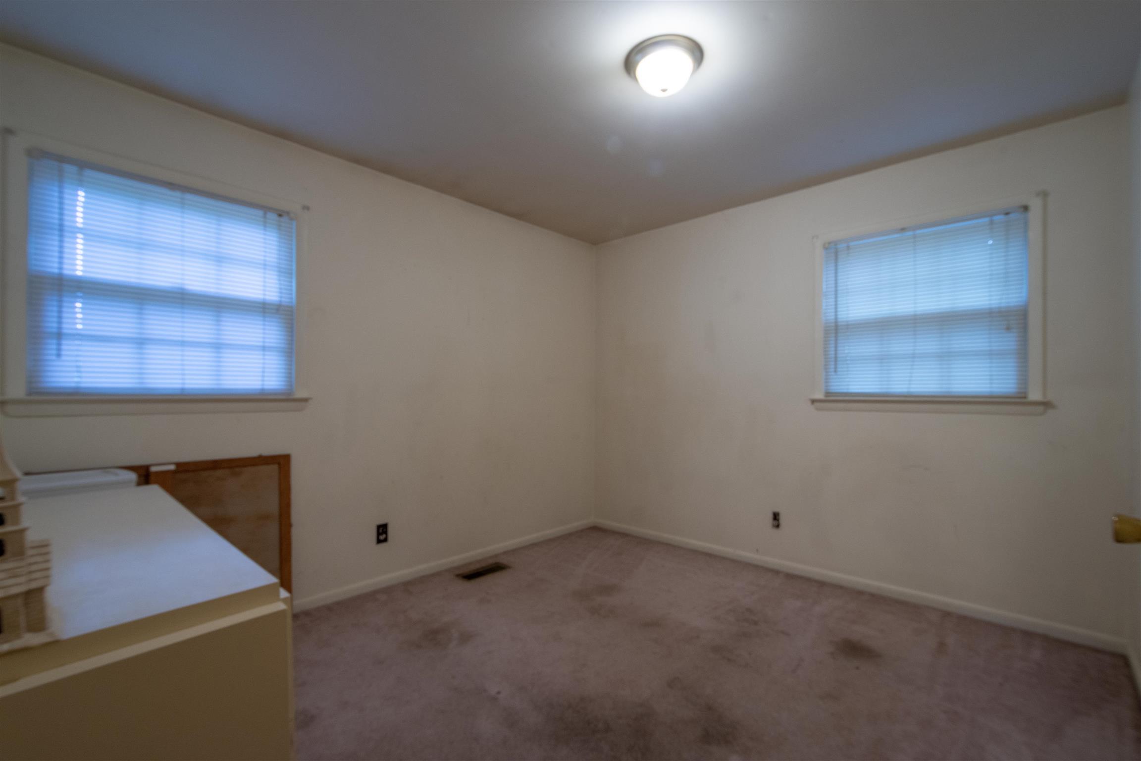 1309 Oak Grove Road Goodspring, TN 38460 - Photo 20 of 29 an empty room with a workbench