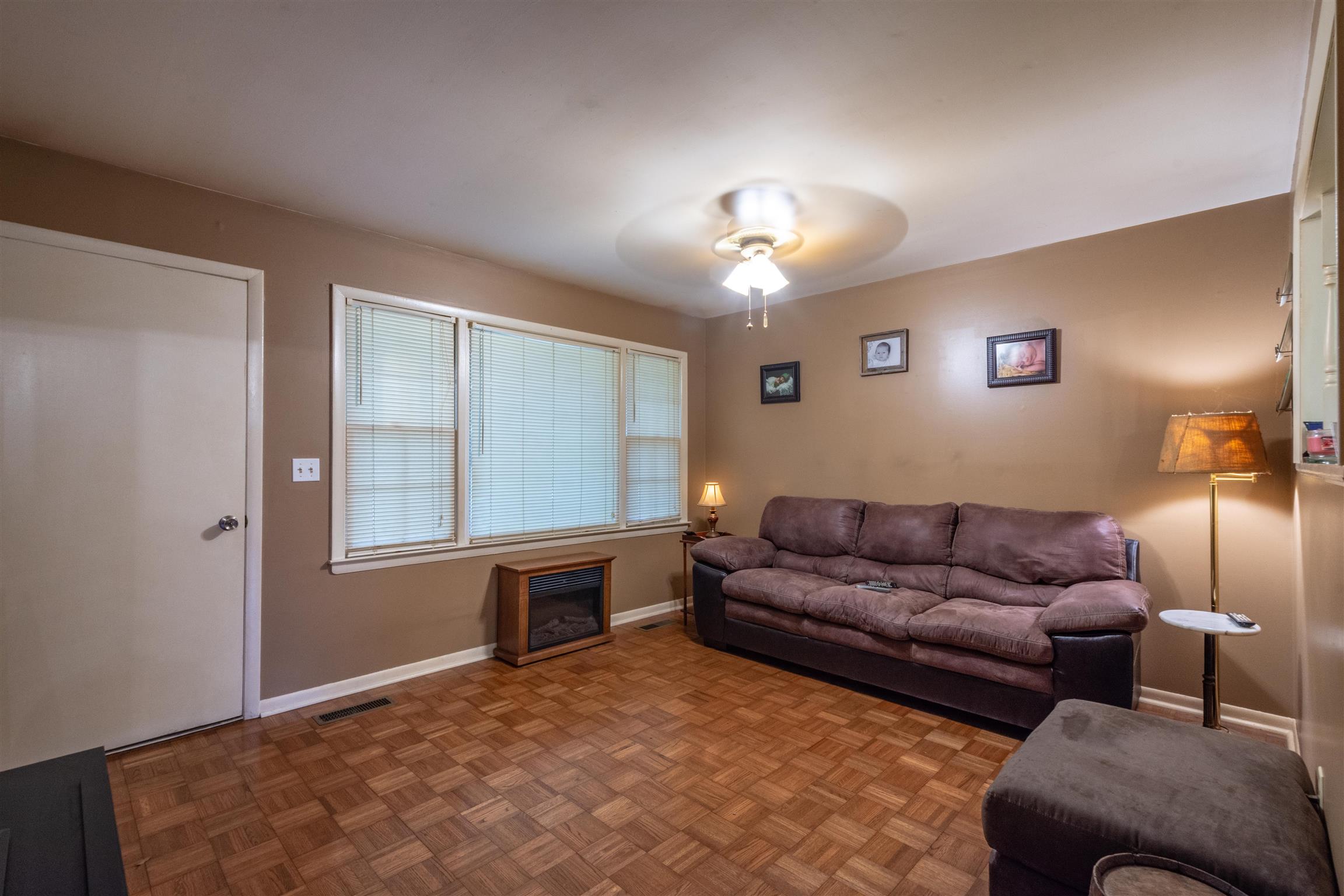 1309 Oak Grove Road Goodspring, TN 38460 - Photo 3 of 29 a living room with furniture and a chandelier