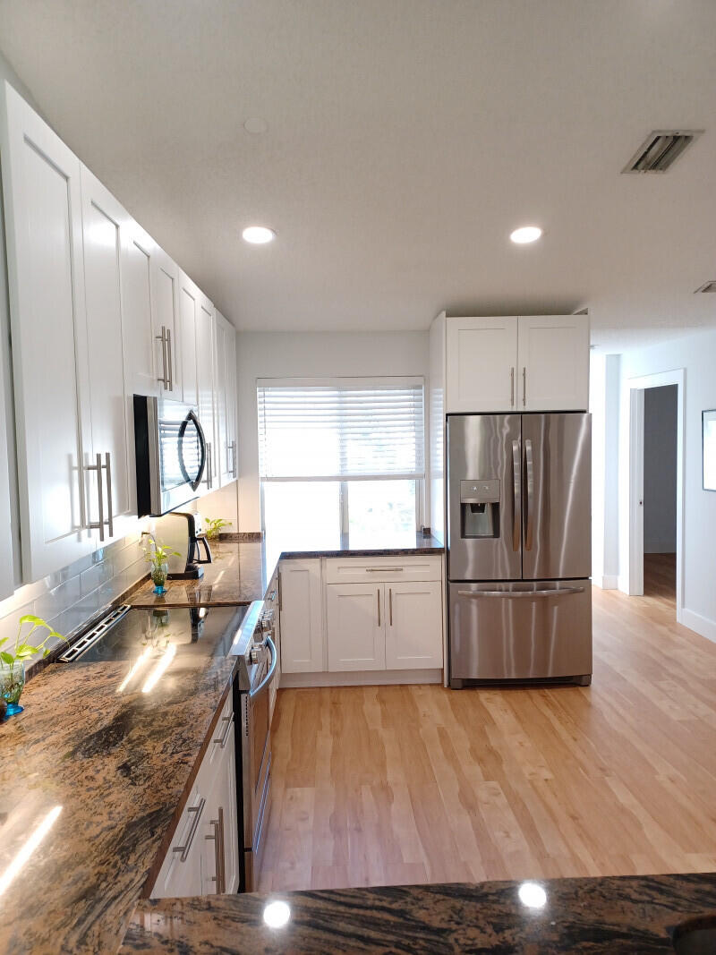 360 Northwest 67th Street, Unit E203 Boca Raton, FL 33487 - Photo 4 of 13 003Kitchen3jpg