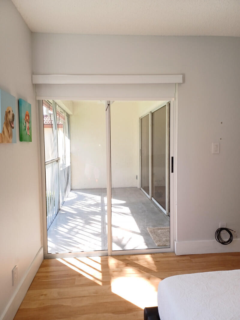 360 Northwest 67th Street, Unit E203 Boca Raton, FL 33487 - Photo 9 of 13 008Masterbedroom2jpg