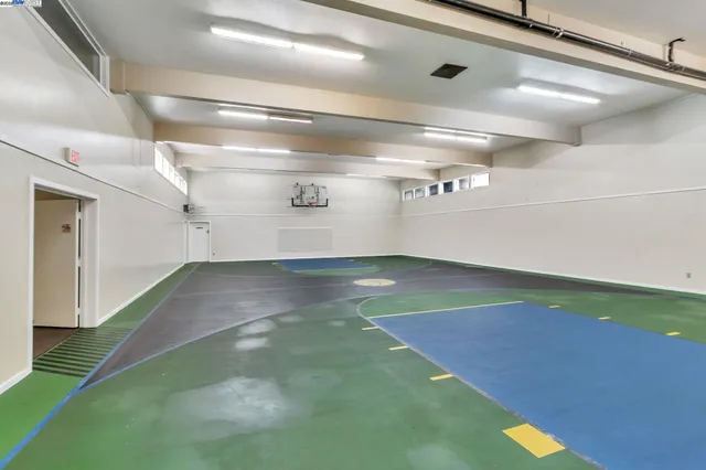 a view of a room with toys and wooden floor