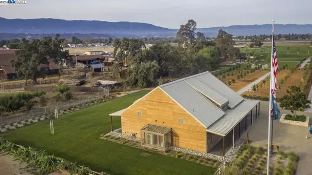 a sign of golf club on a tree with a sign board