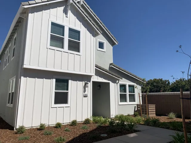 a front view of a house with garage