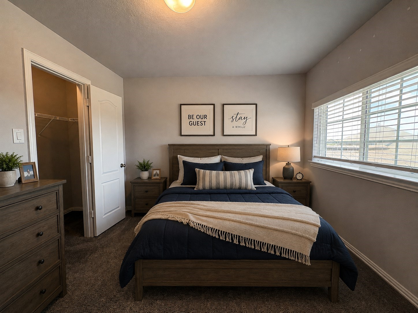 140 Kelly Street Angleton, TX 77515 - Photo 26 of 32 Experience comfort and style in this elegantly virtually staged bedroom, featuring cozy bedding, soft lighting, and a spacious walk-in closet. ** Virtually staged **