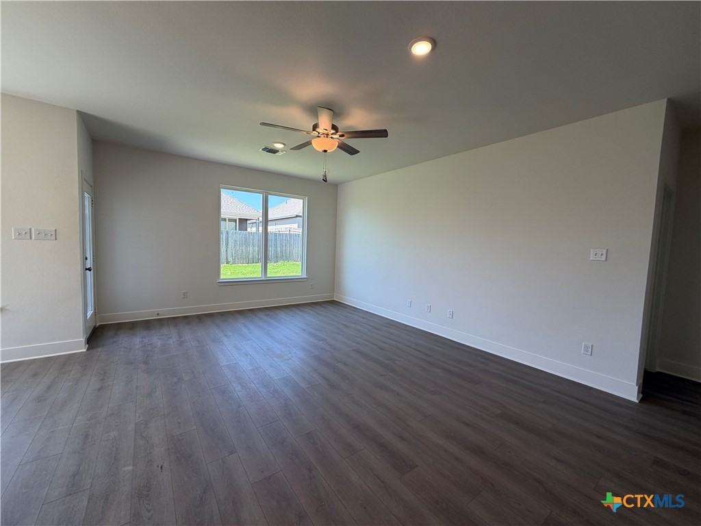 1985 Mercer Street Nolanville, TX 76559 - Photo 17 of 24 wooden floor in an empty room with a window