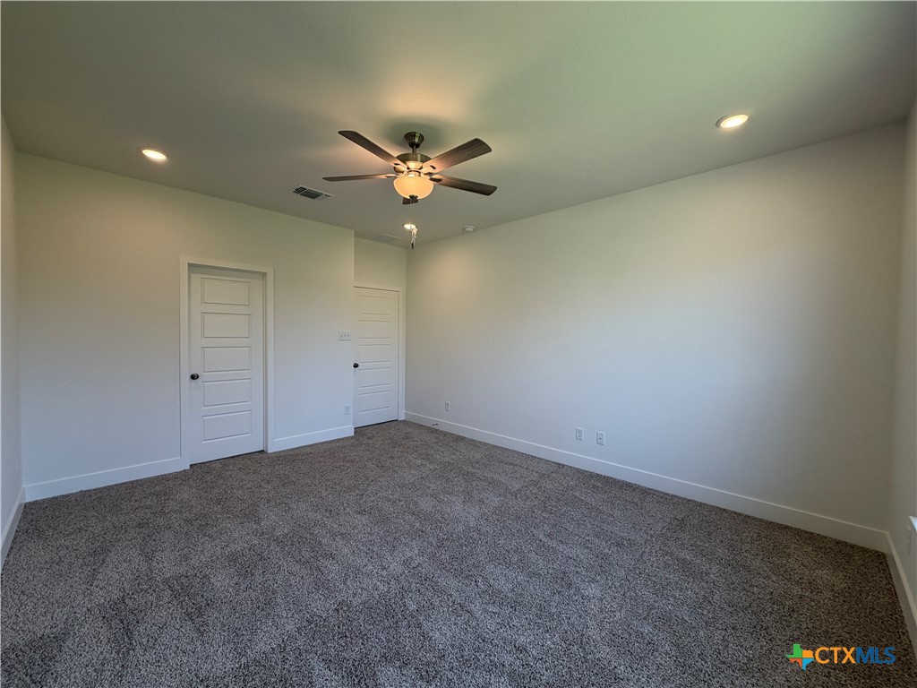 1985 Mercer Street Nolanville, TX 76559 - Photo 20 of 24 an empty room with a window and a fan