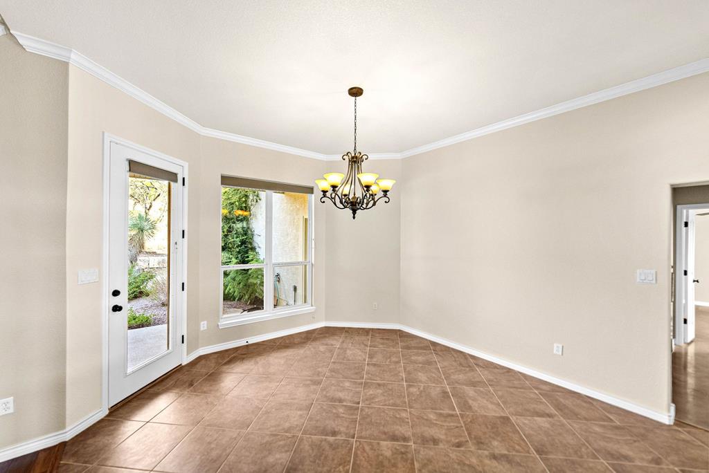 103 Cranbrook Court Ingram, TX 78025 - Photo 11 of 61 wooden floor in an empty room with a window