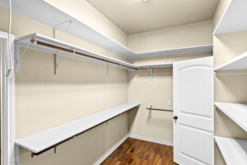 103 Cranbrook Court Ingram, TX 78025 - Photo 25 of 61 a view of walk in closet with empty racks