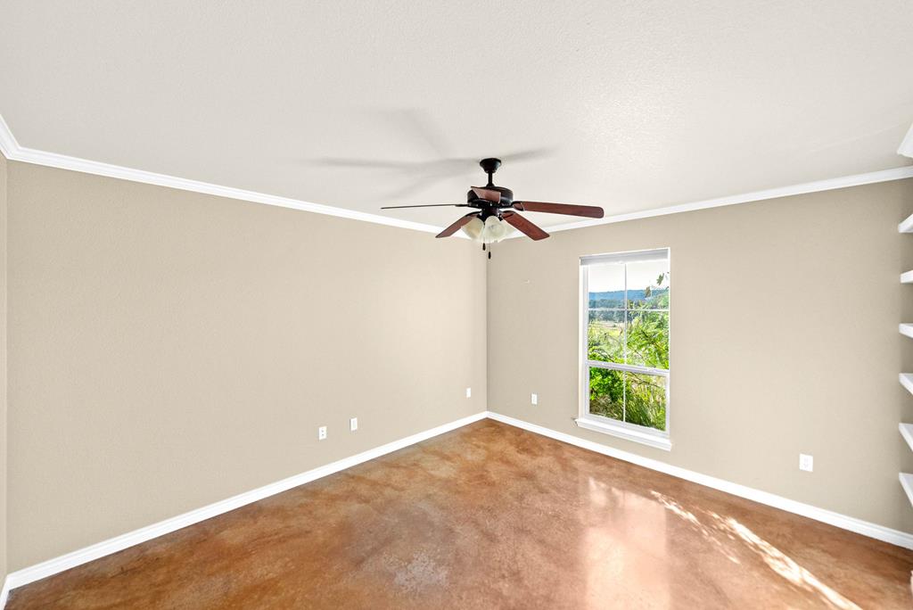 103 Cranbrook Court Ingram, TX 78025 - Photo 35 of 61 a view of a room with a ceiling fan and a window