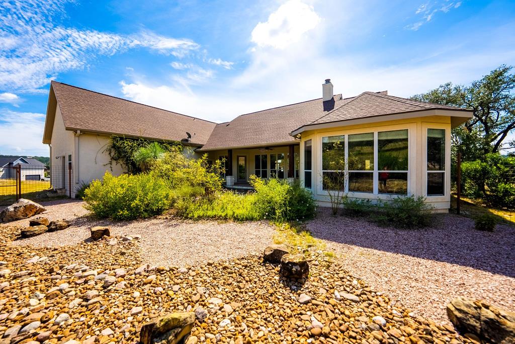 103 Cranbrook Court Ingram, TX 78025 - Photo 41 of 61 a front view of a house with a garden