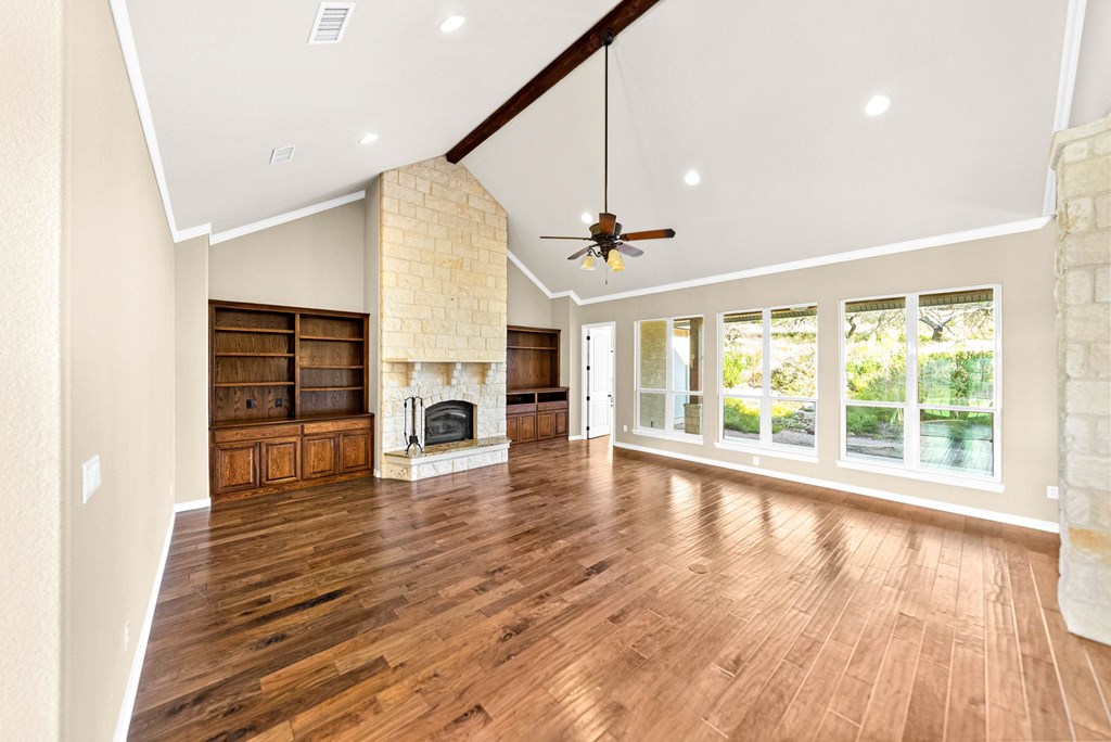 103 Cranbrook Court Ingram, TX 78025 - Photo 6 of 61 a view of an empty room with wooden floor and a window