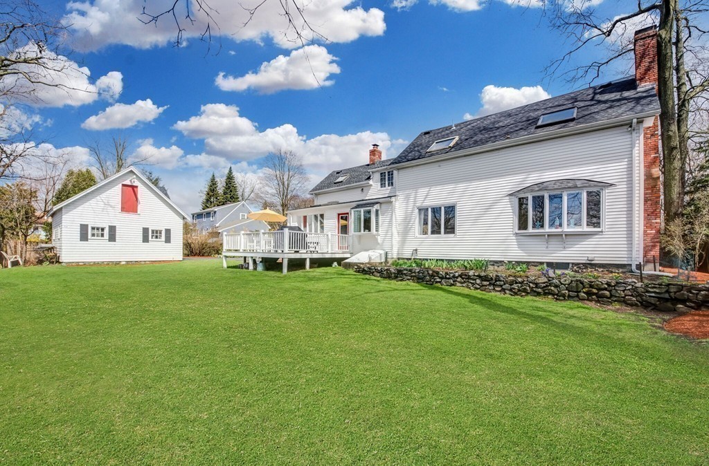 16 Spring Street Wakefield, MA 01880 - Photo 23 of 23 a view of an house with backyard space and garden