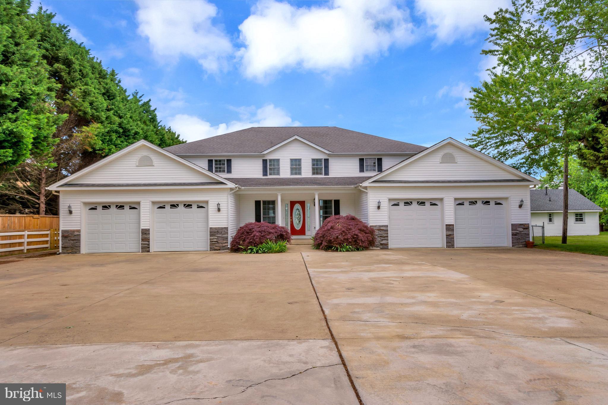 621 Marlborough Point Road Stafford, VA 22554 - Photo 1 of 30 a front view of a house with a yard and garage