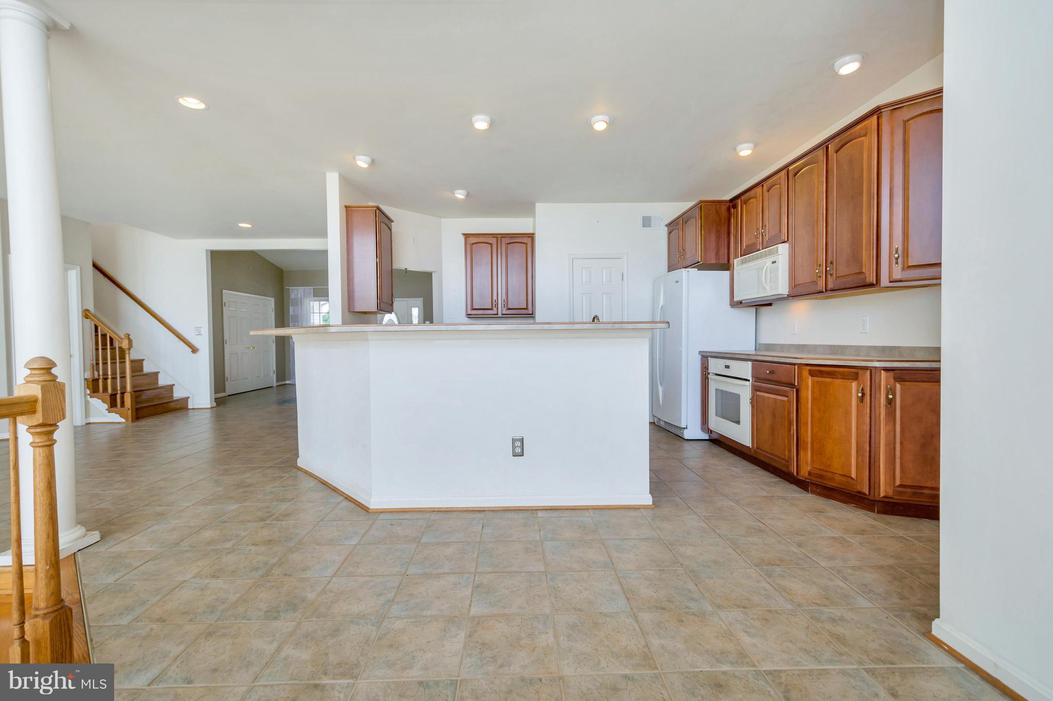 621 Marlborough Point Road Stafford, VA 22554 - Photo 22 of 30 a kitchen with stainless steel appliances a refrigerator and a sink
