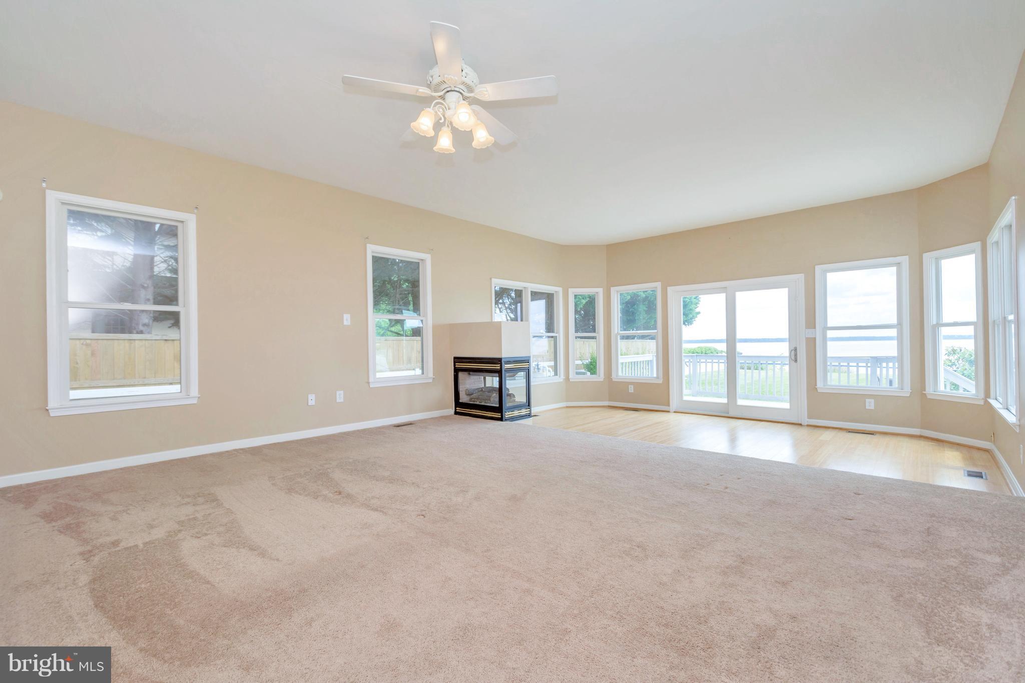 621 Marlborough Point Road Stafford, VA 22554 - Photo 26 of 30 a view of an empty room with a fireplace and a large window