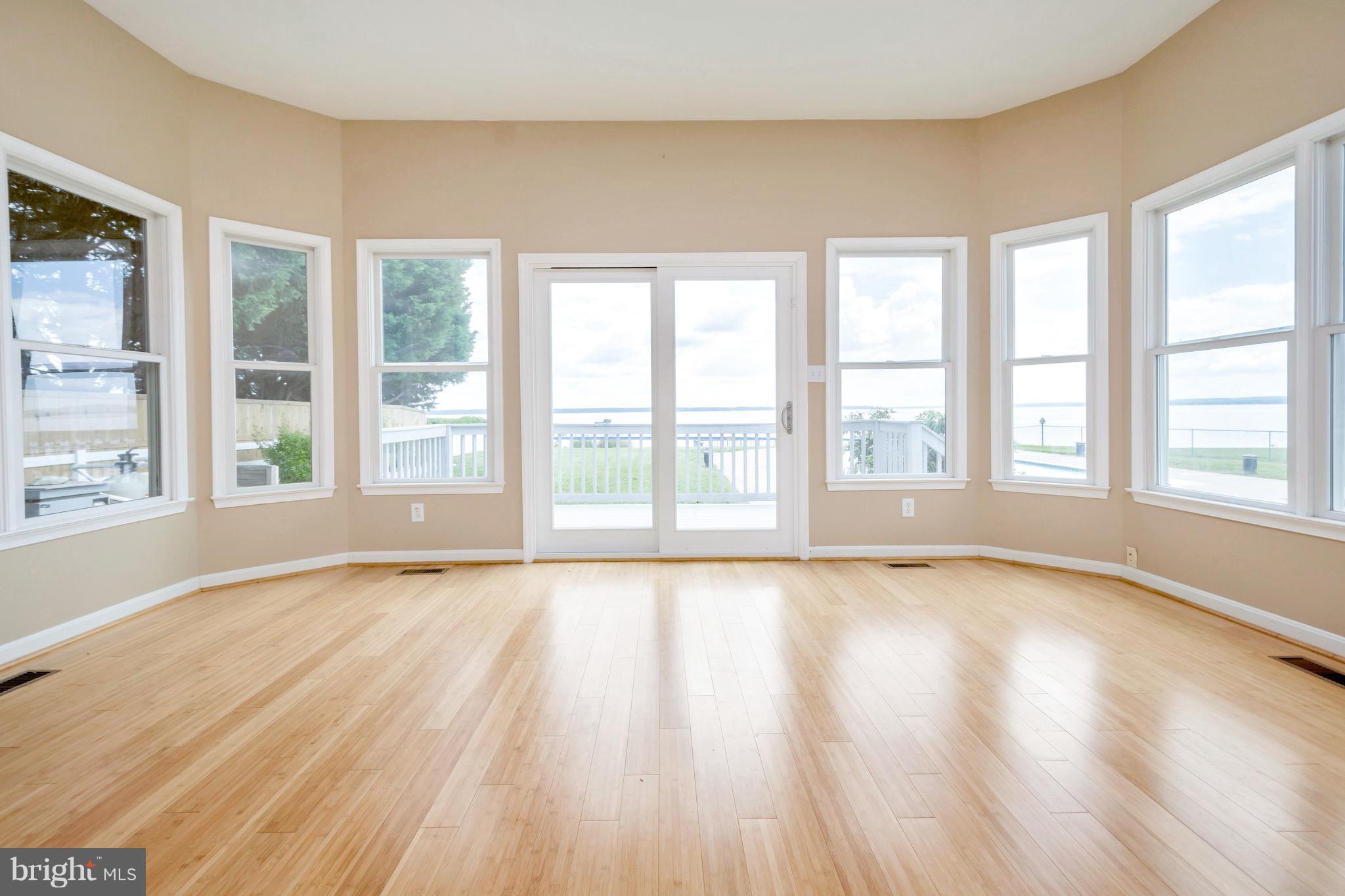 621 Marlborough Point Road Stafford, VA 22554 - Photo 27 of 30 a view of an empty room with a window and wooden floor