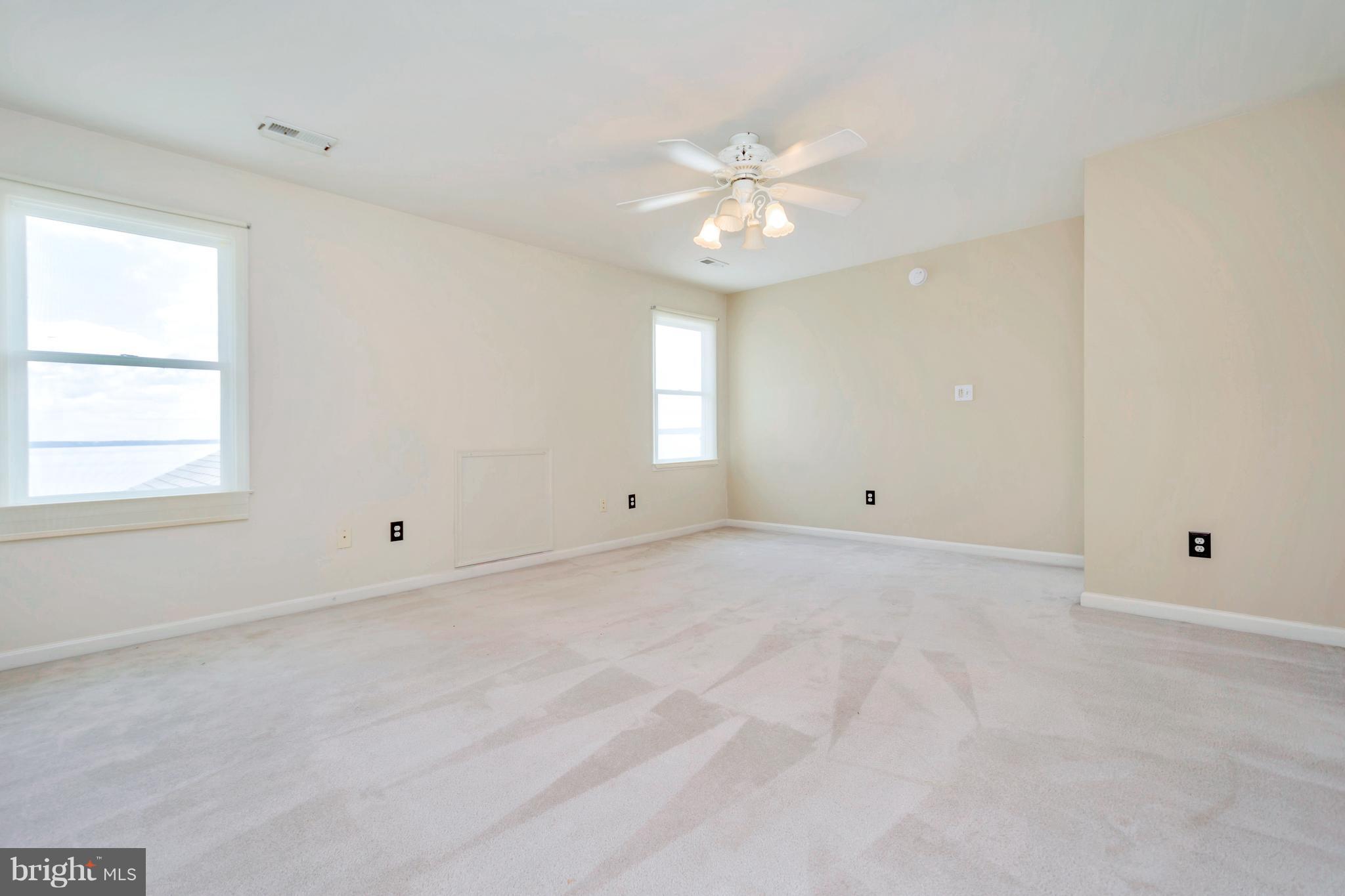621 Marlborough Point Road Stafford, VA 22554 - Photo 29 of 30 an empty room with windows and fan