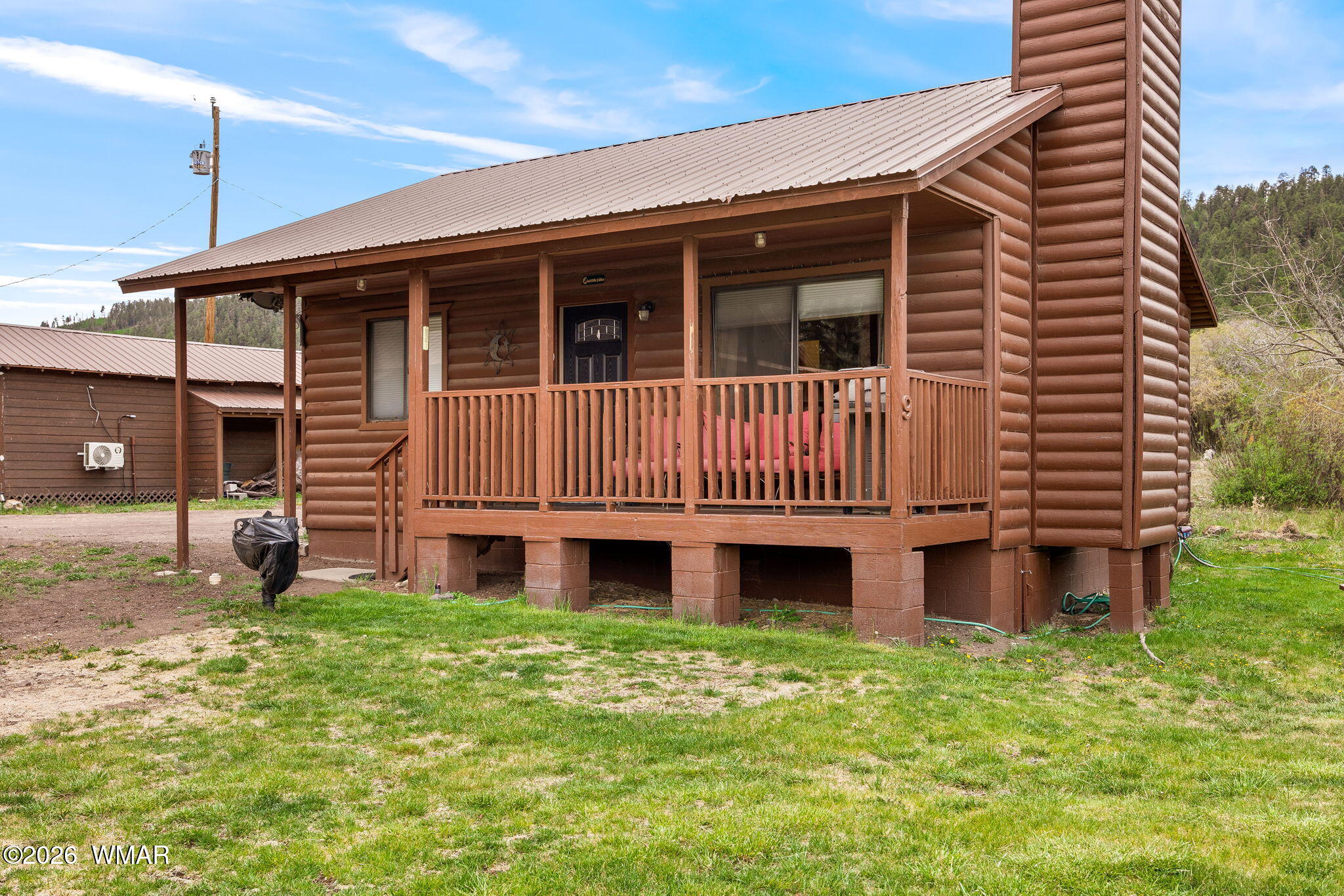 85 Main Street Greer, AZ 85927 - Photo 26 of 55 a front view of a house with a yard