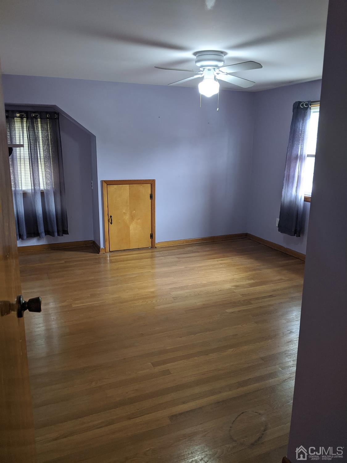 73 Highfield Road Colonia, NJ 07067 - Photo 11 of 16 a view of livingroom with hardwood floor and window