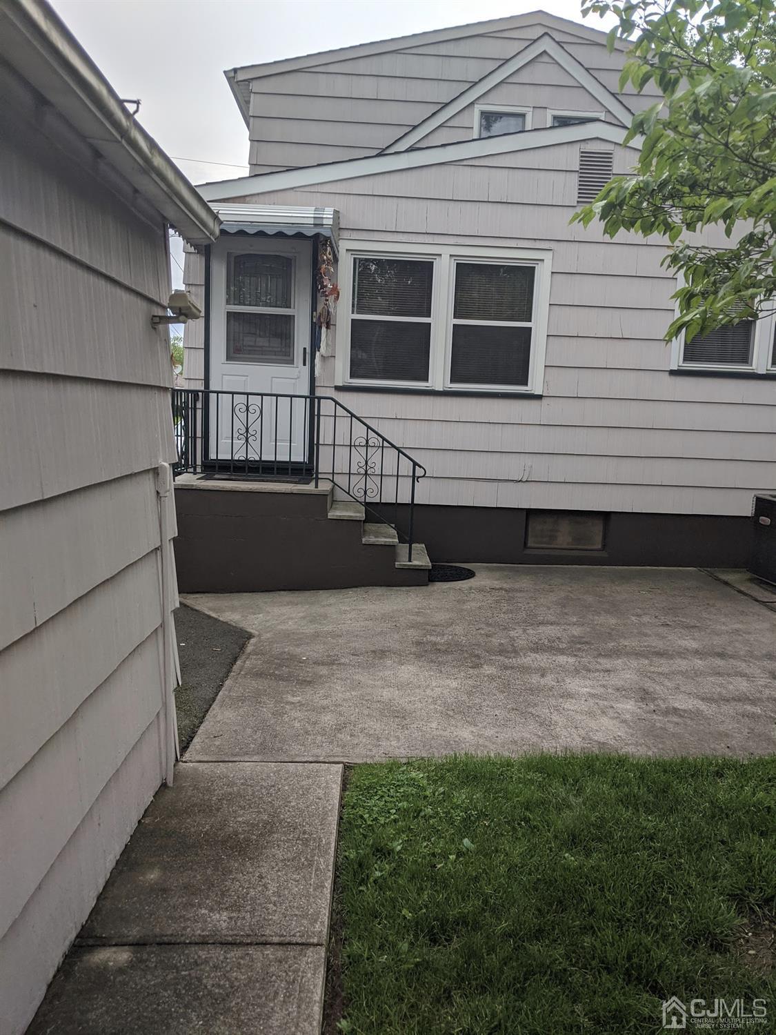 73 Highfield Road Colonia, NJ 07067 - Photo 13 of 16 a front view of a house with a yard