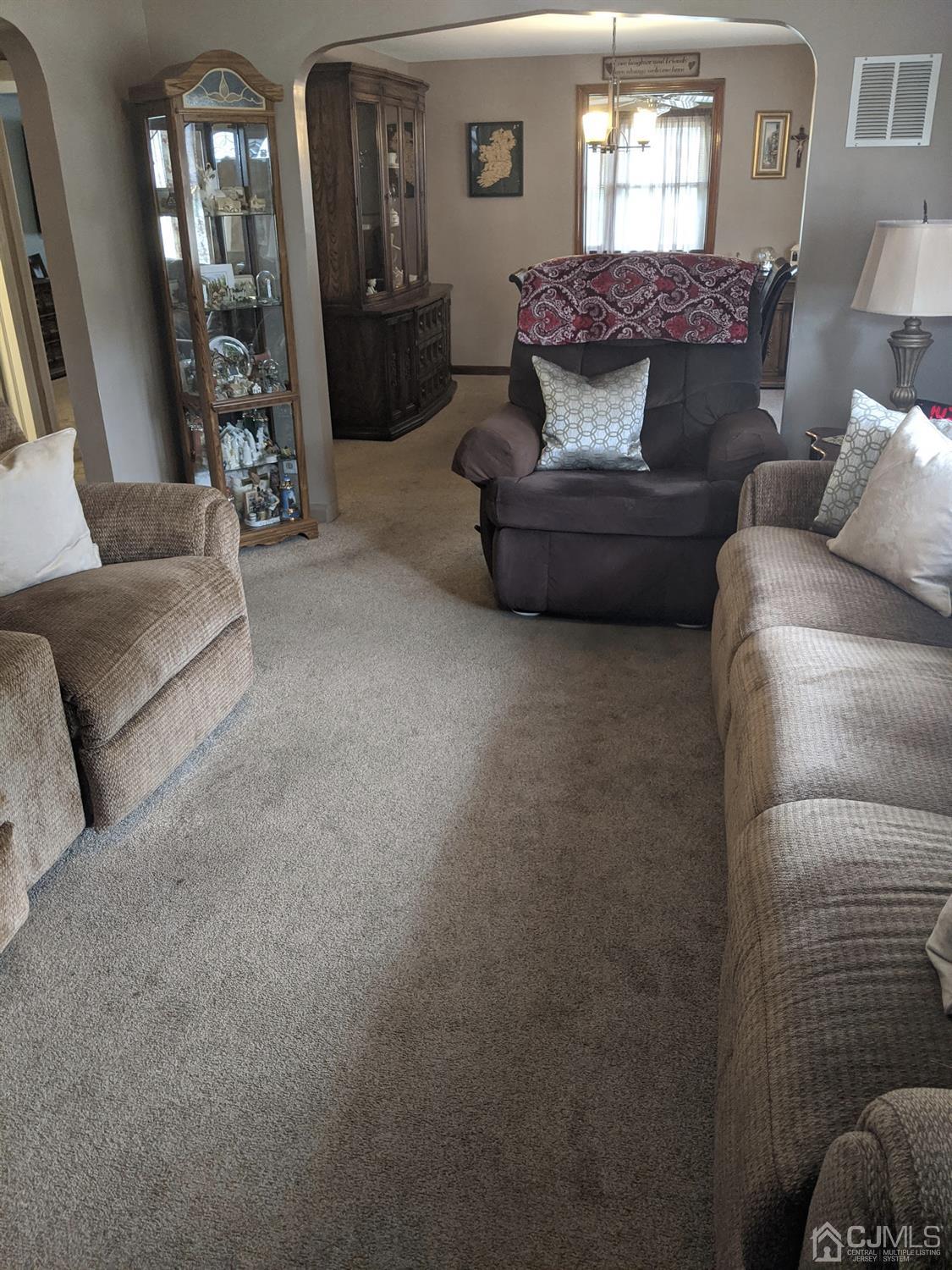 73 Highfield Road Colonia, NJ 07067 - Photo 7 of 16 a living room with furniture and a large window