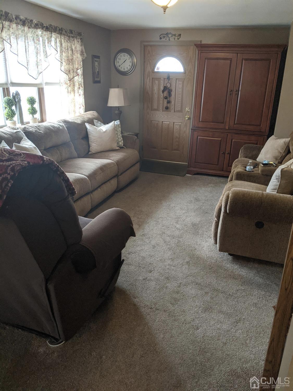 73 Highfield Road Colonia, NJ 07067 - Photo 8 of 16 a living room with furniture and a window